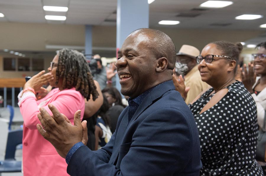 Image of audience giving standing ovation. Open Gallery